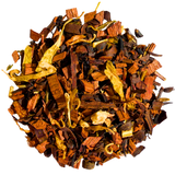 Pile of Honeyed Peach loose-leaf infusion with brown honeybush pieces and yellow petals