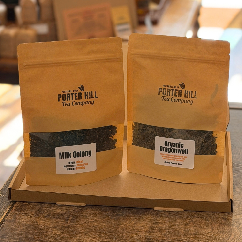 Milk Oolong and Organic Dragonwell loose leaf tea pouches in a gift box