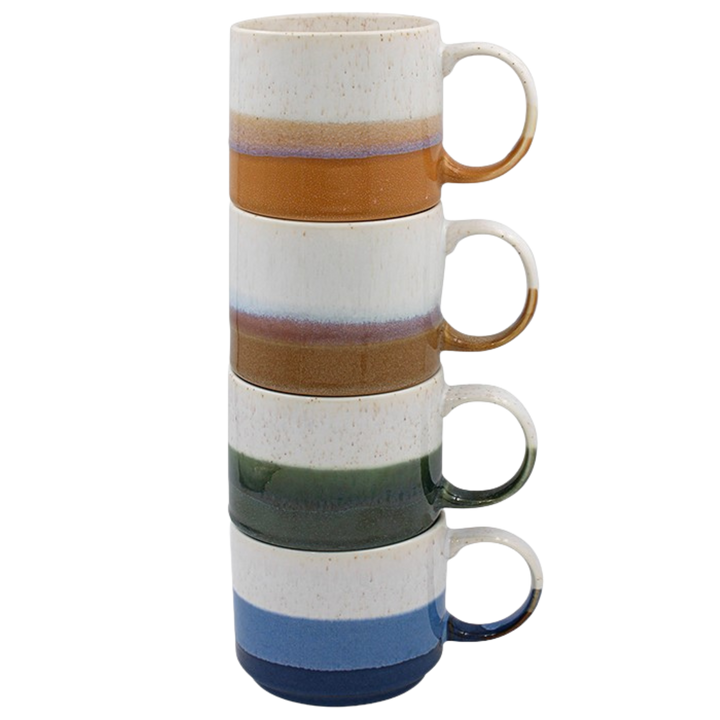 Four Elements mugs stacked in amber, brown, green and blue