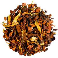 Pile of Honeyed Peach loose-leaf infusion with brown honeybush pieces and yellow petals