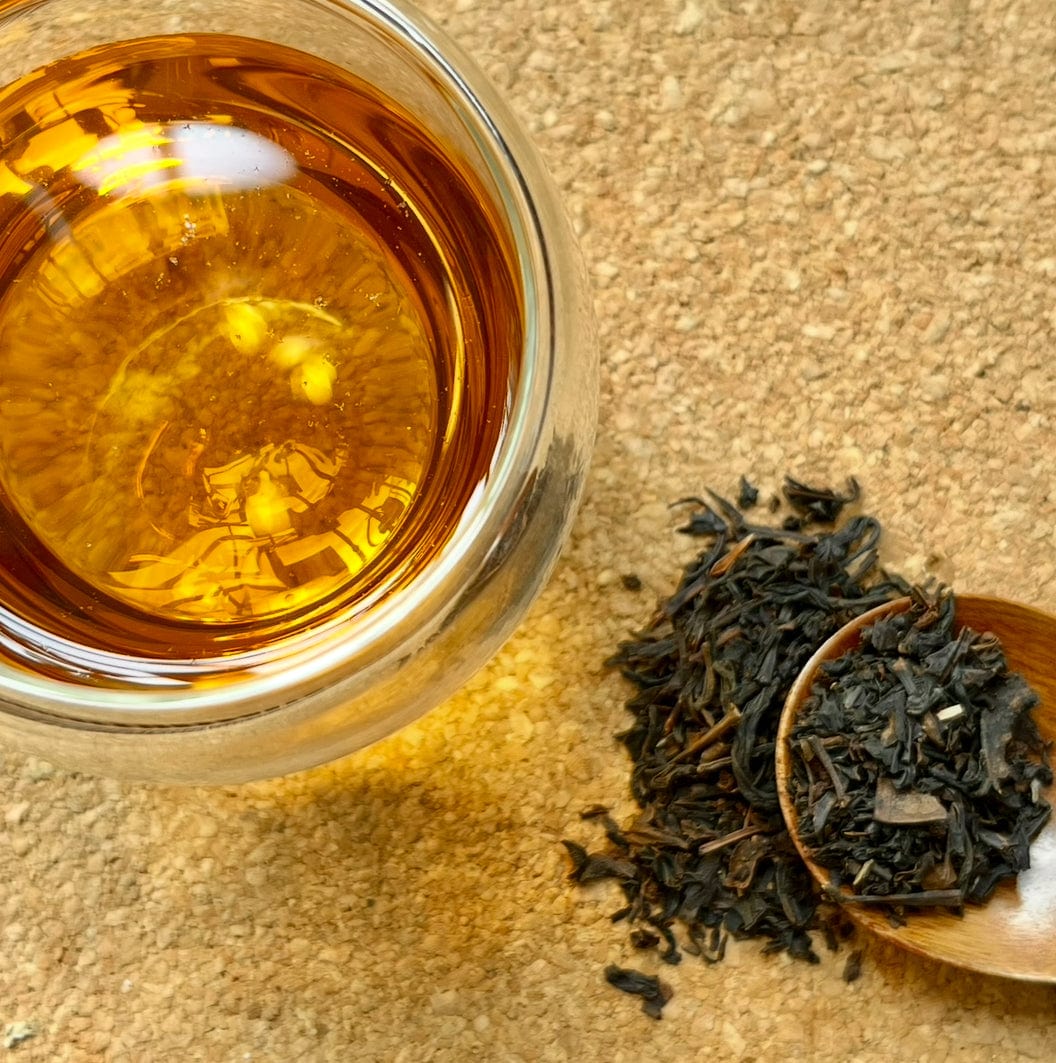 Weaver’s Blend black tea beside its loose leaves