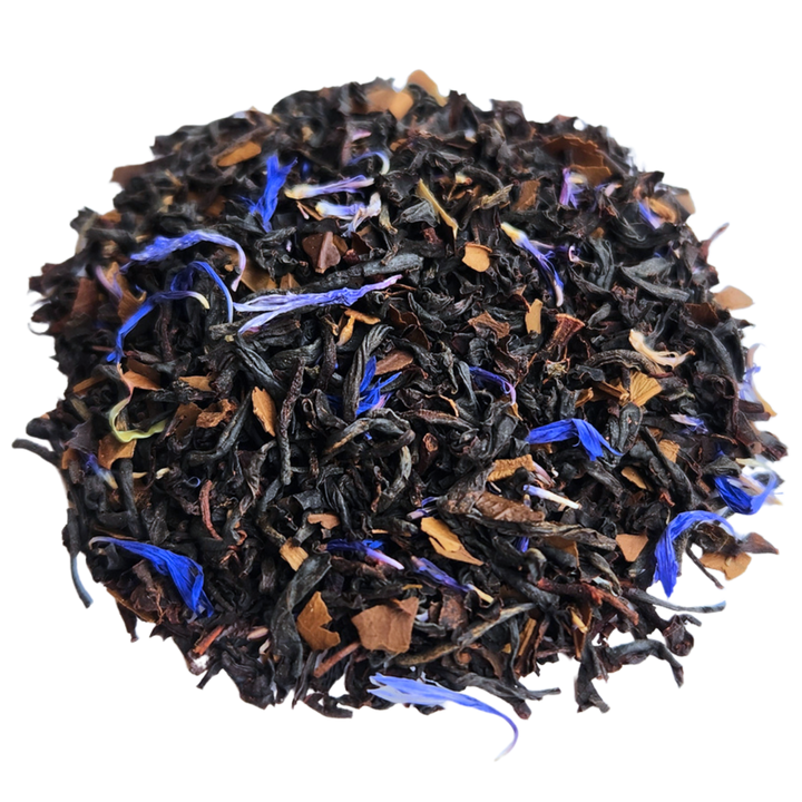 Pile of dark Terrier Tea blend with brown leaf pieces and blue cornflower petals