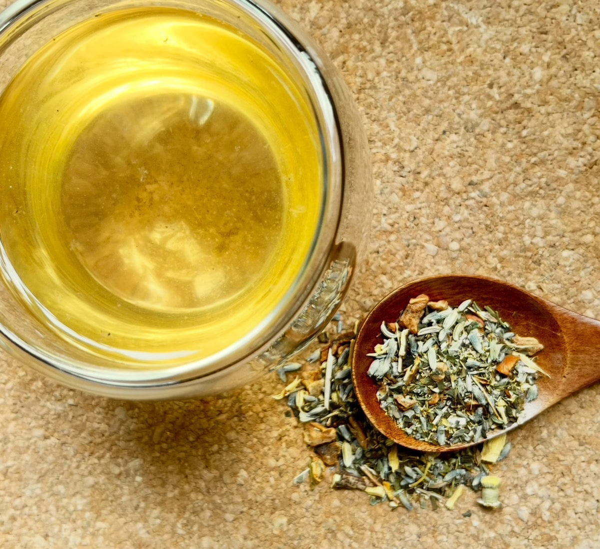 Sweet Dreams herbal tea beside its loose ingredients