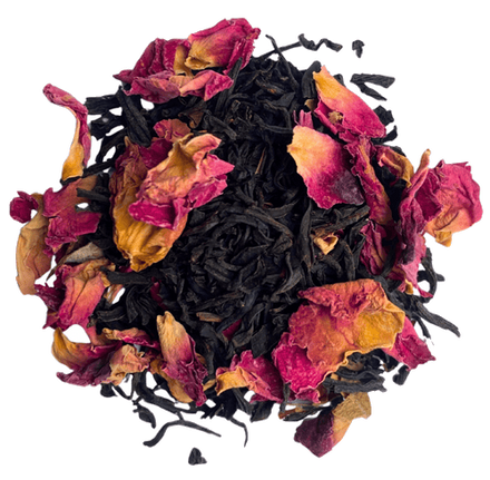 Pile of loose Keemun black tea leaves mixed with dried pink rose petals