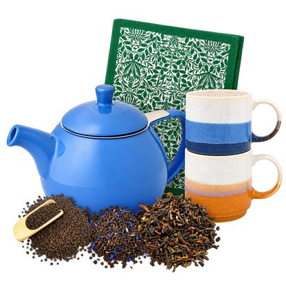 The Complete Tea Ritual: blue FORLIFE teapot, two stacked Elements mugs, Acorn tea towel and three loose leaf teas arranged in a compact overlapping group.