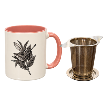 Pink Porter Hill mug with Lauren J. Squires’ botanical tea leaf illustration beside the stainless steel basket infuser and lid