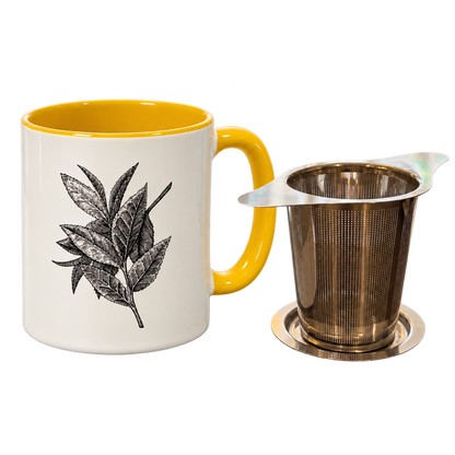 Yellow Porter Hill mug with Lauren J. Squires’ tea leaf illustration beside the stainless steel basket infuser and lid