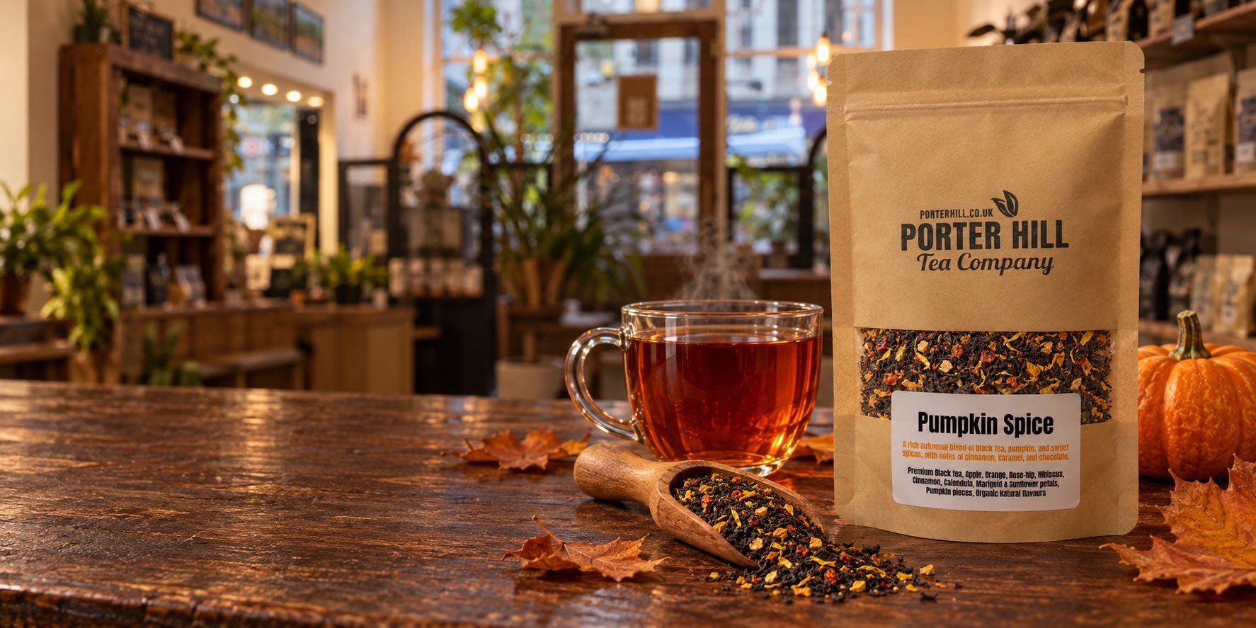 Porter Hill loose leaf teas, teapot and autumn leaves on a wooden table
